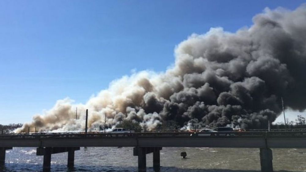 Railroad will be out at least a week after trestle fire