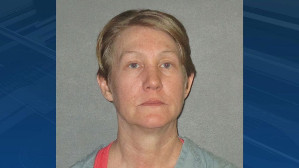 Naked woman trashes clothing store, jumps on car