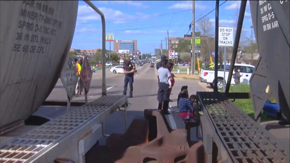 Woman taken to the hospital following train wreck