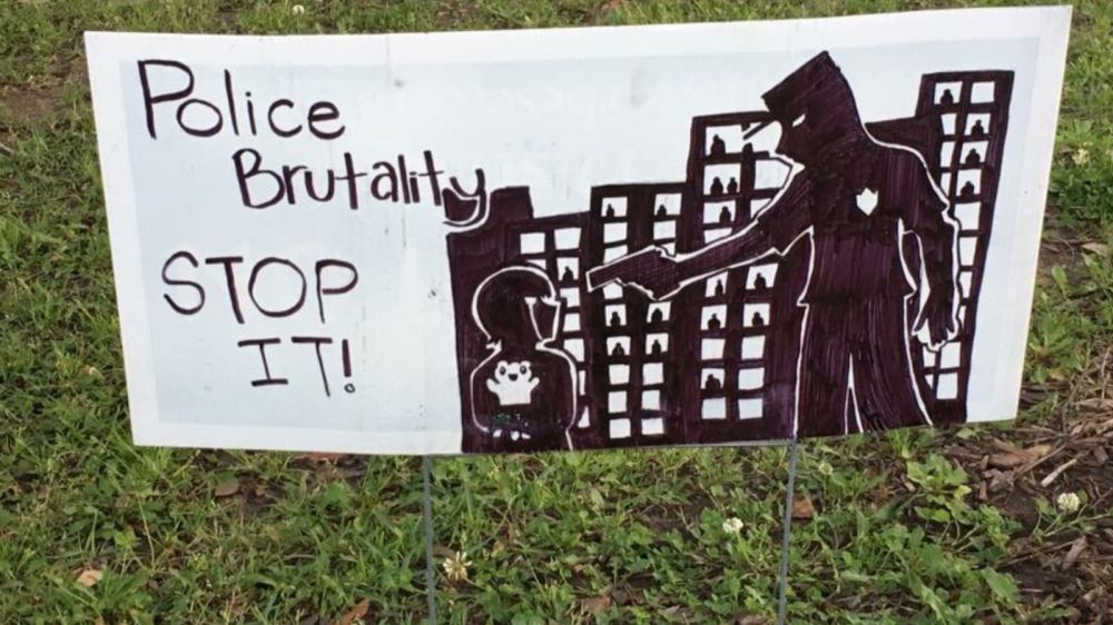 Poster outside EBR library prompts talk about how police are perceived