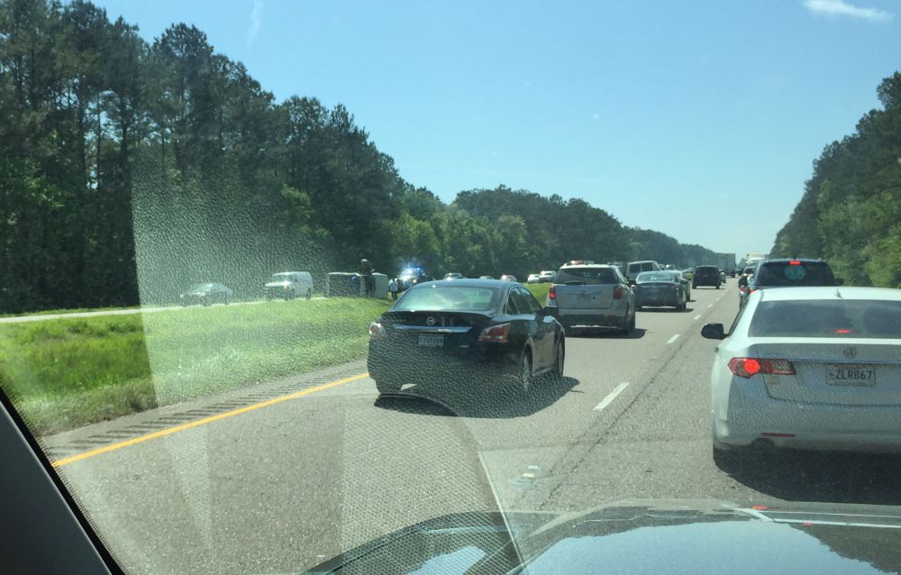 Overturned vehicle blocks lanes on I-12 in Livingston