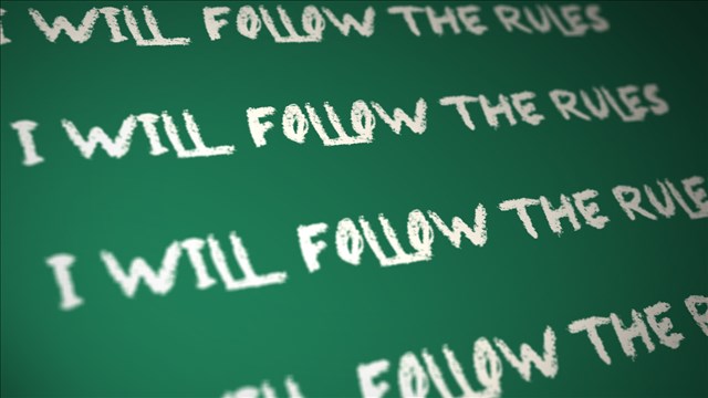 Teacher charged with hanging child by belt on chalkboard