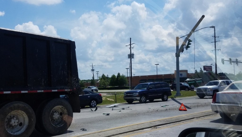 Congestion after dump truck strikes Burbank Drive traffic light