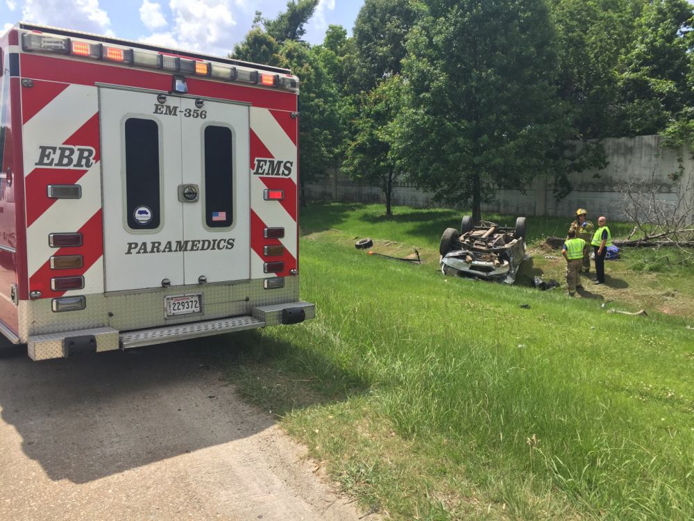 Vehicle upside down after hitting I-12 mowing operation, city reports
