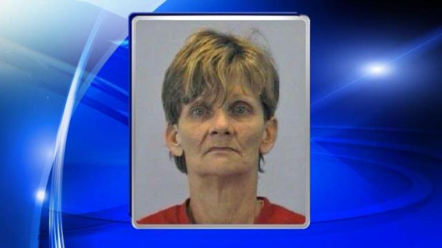 Woman charged after body found in freezer sold at yard sale