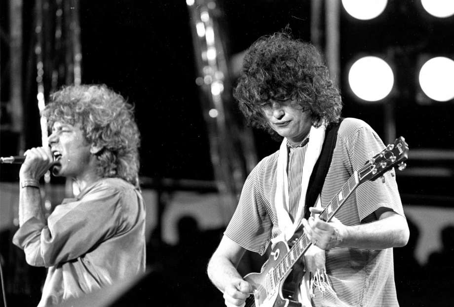 Led Zeppelin's Page dodges court questions, riffs air guitar