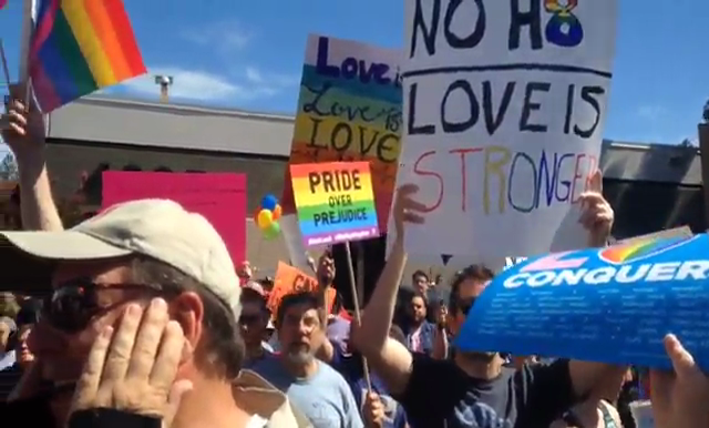 Hundreds rally after pastor praises shooting