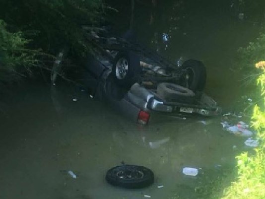 Woman rescued after nine hours in flipped and flooded SUV