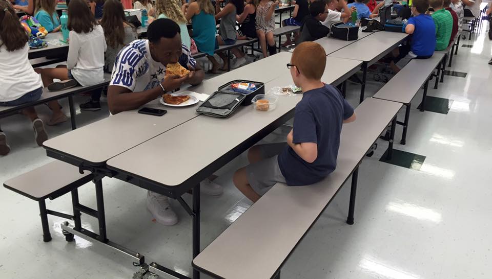 FSU football player eats lunch with student sitting alone