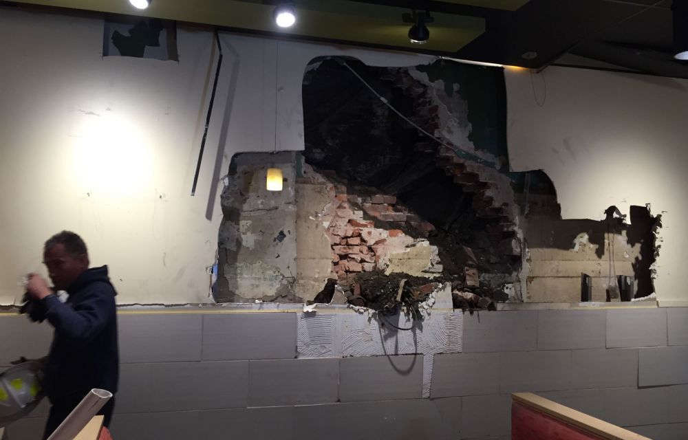 Crews free man stuck between buildings after bid to impress woman