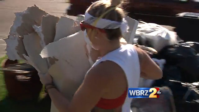 Tourists help local flood victims rebuild