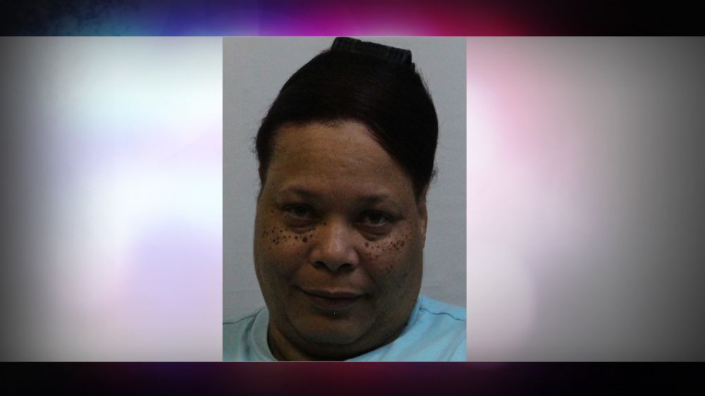 Woman arrested after shoving teacher against wall