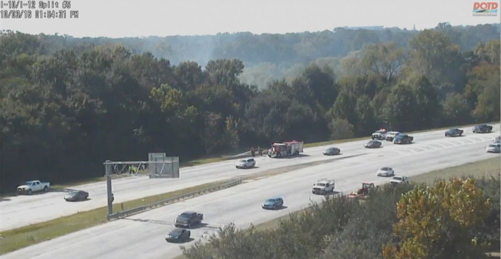 Grass fire, wreck slow traffic Monday