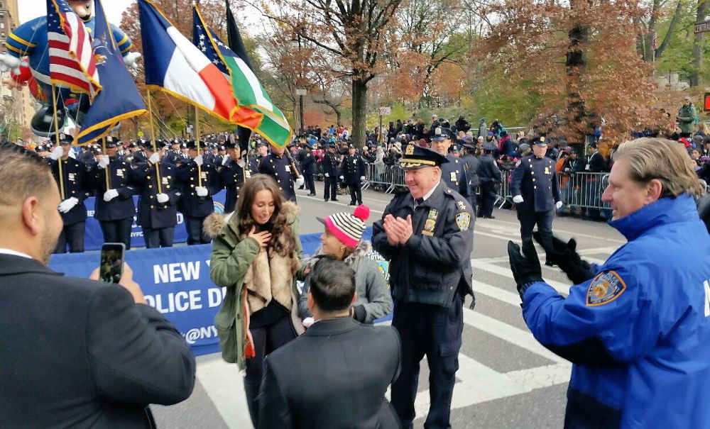 Everyone loves a proposal: Policeman pops question at parade