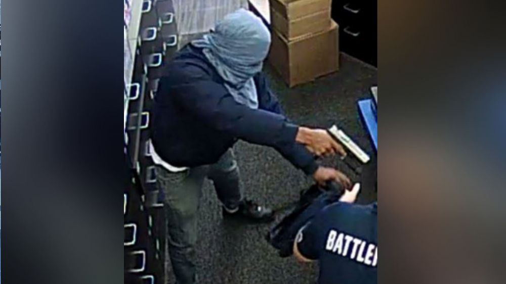 Business' employees come face to face with robber's gun Monday morning