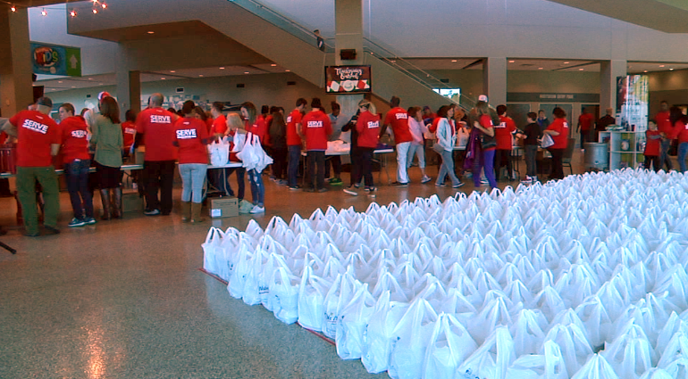 Hundreds help deliver hot meals to flood victims