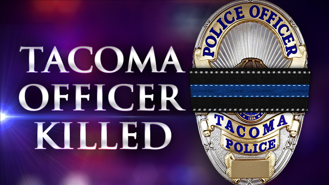 Hundreds attend vigil for slain officer