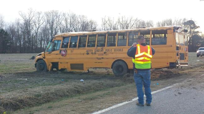 School bus carrying 19 swerves to avoid deer, overturns