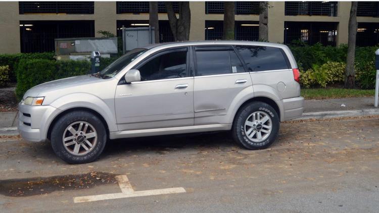 Dead man found in SUV that had pile of parking tickets on it