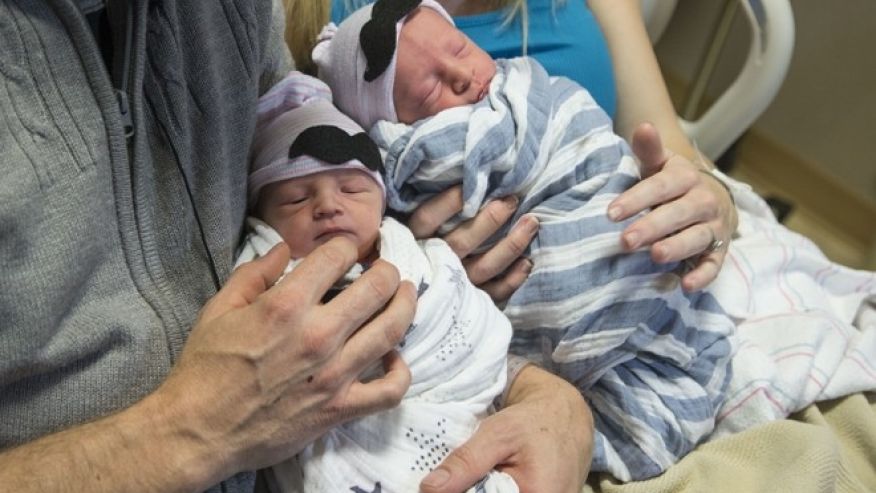 Twins delivered minutes apart have different birth years