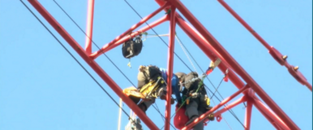 Police: 7 protesters climb crane at DC contruction site