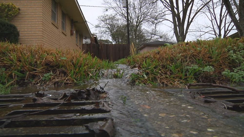 Workers scrambled to unclog ditches in the rain