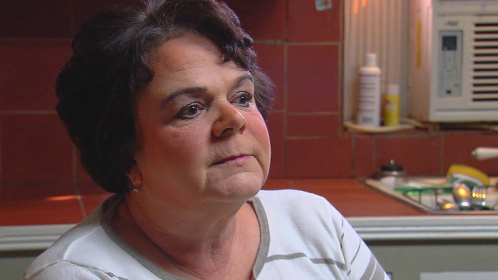 Legally blind teacher works, can't get disability assistance