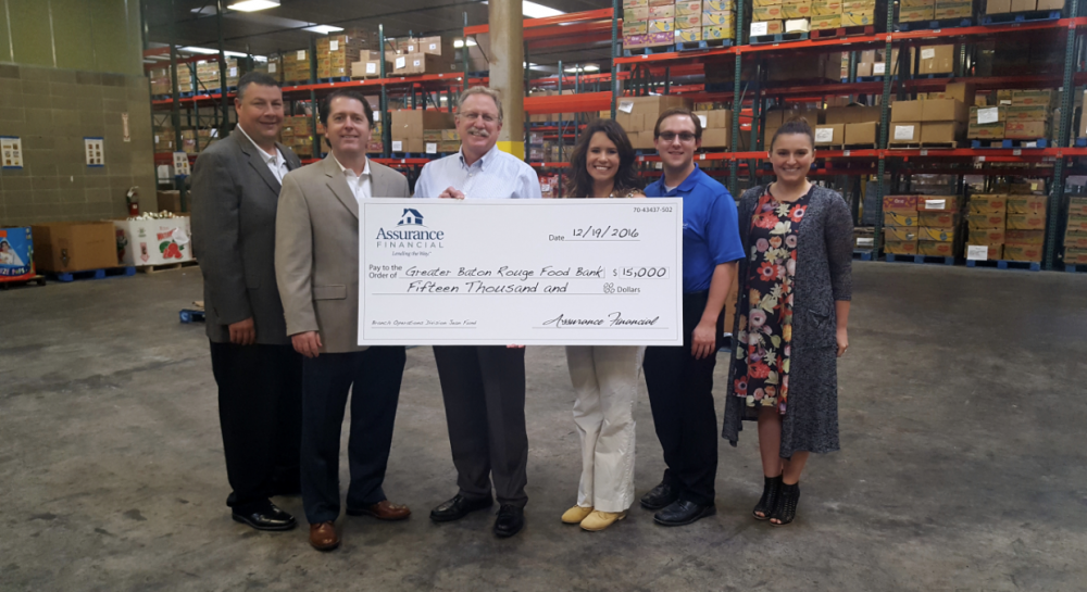 Mortgage company donates $15,000 to local food bank