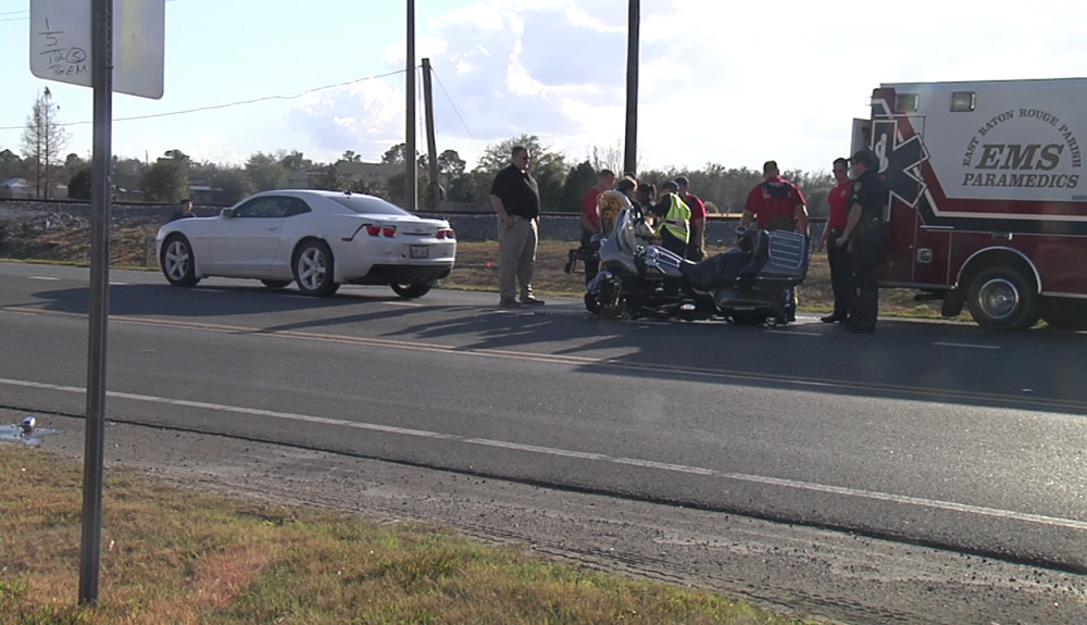 Crash involving motorcycle, driving school car off Nicholson Drive