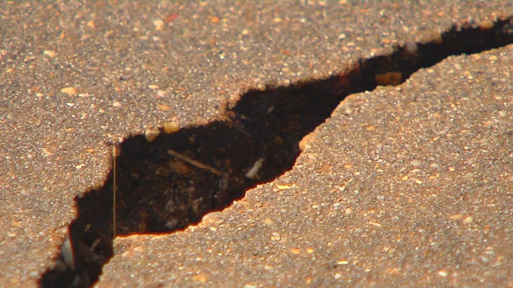 Homeowner blames sinking driveways on parish, wants them fixed