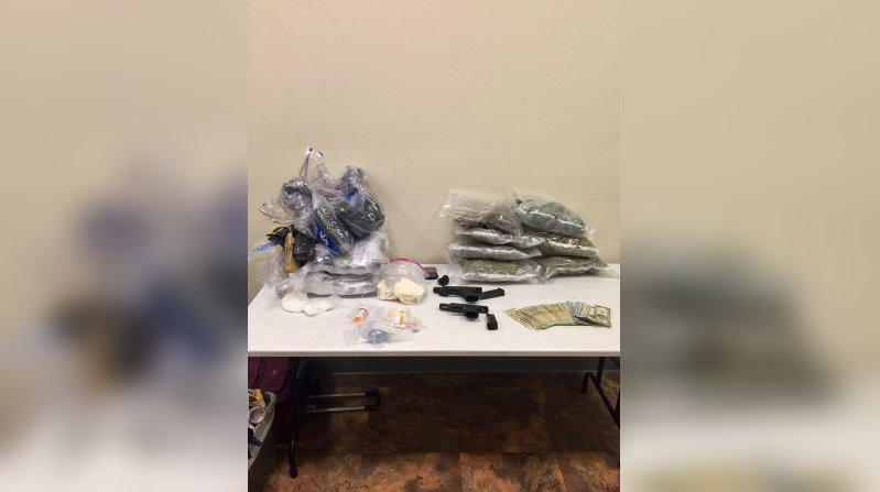 Investigations lead to seizure of drugs, guns, money and 2 arrests