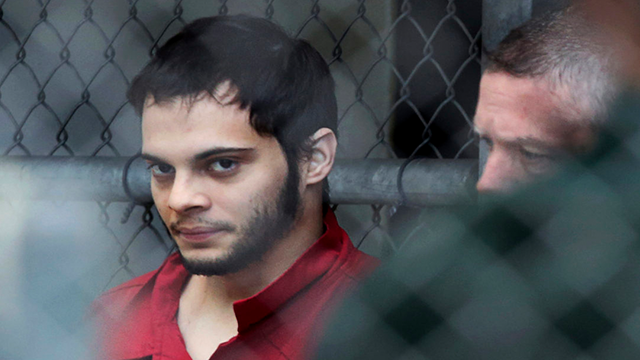 Alleged airport shooter lied on guard application