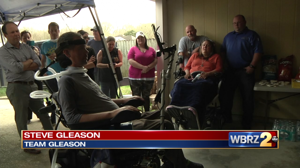 Volunteers with Team Gleason and St. Bernard Project help flood survivors rebuild