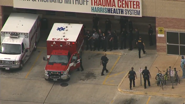 Manhunt in Houston after burglary suspects shoot two police officers