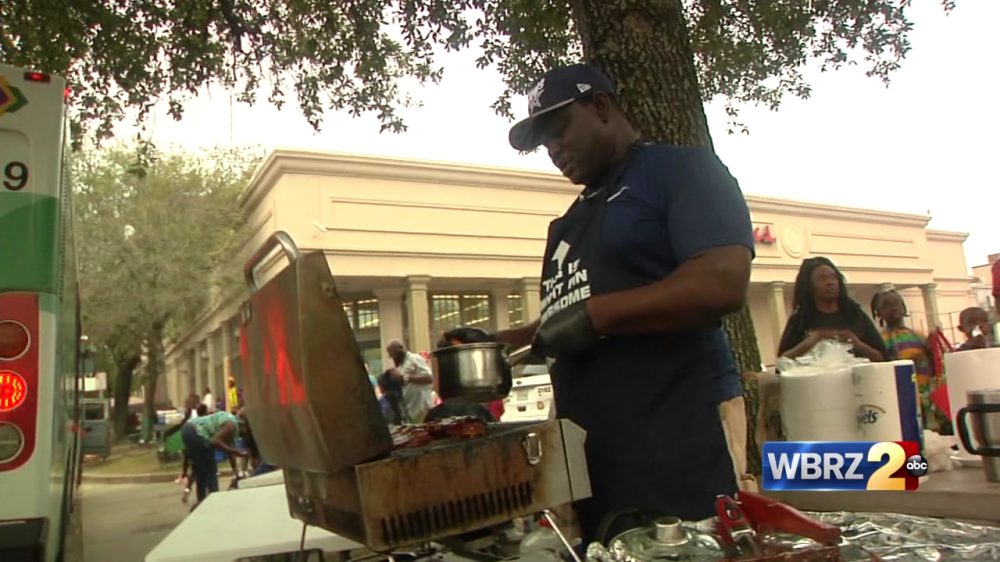 Mardi Gras goers enjoy food along parade routes