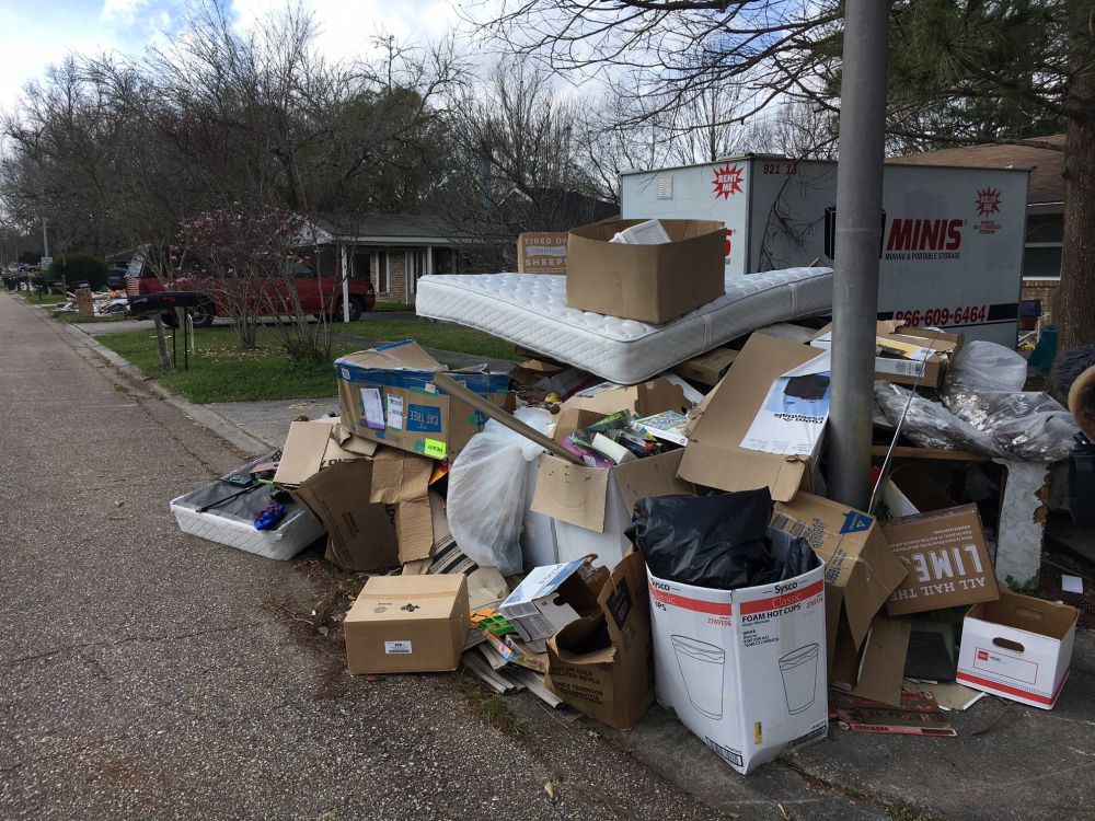 Flood debris still clogging neighborhoods, deadline extended