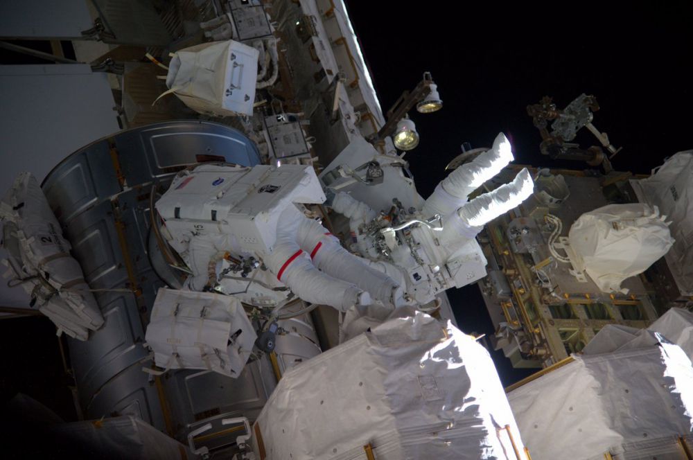 Spacewalking astronauts lose piece of shielding
