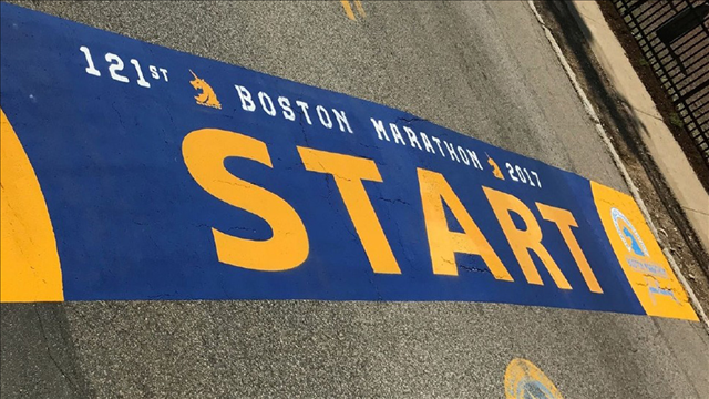 Boston marathon athletes begin trek in waves