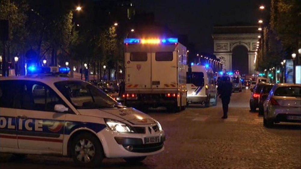 Paris police say officer and attacker shot, killed