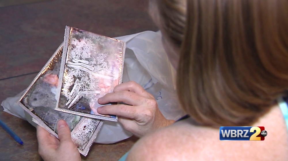 Volunteers help to restore flood-damaged photos