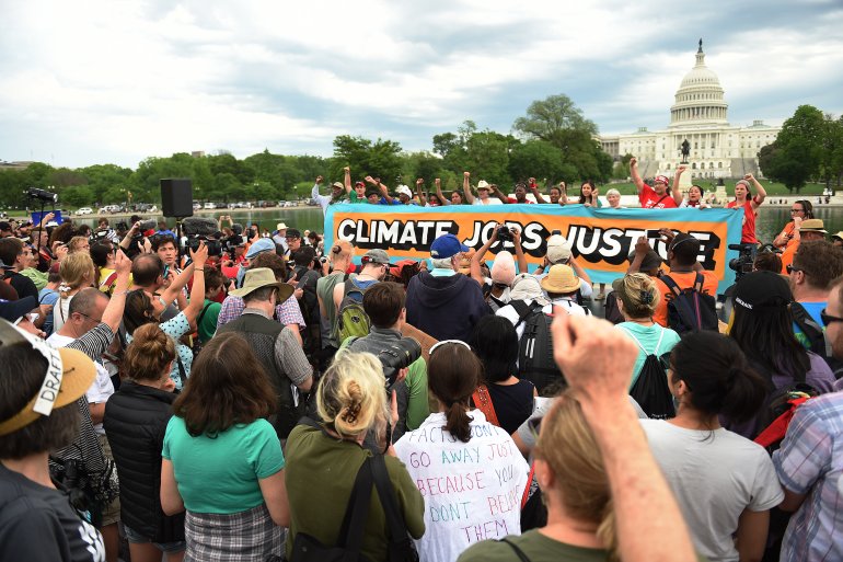Marchers use Trump's 100th day to protest climate policies