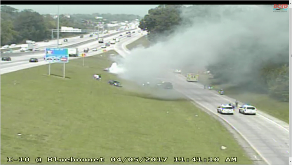 Firefighters extinguish car fire on I-10 west near Bluebonnet Blvd.
