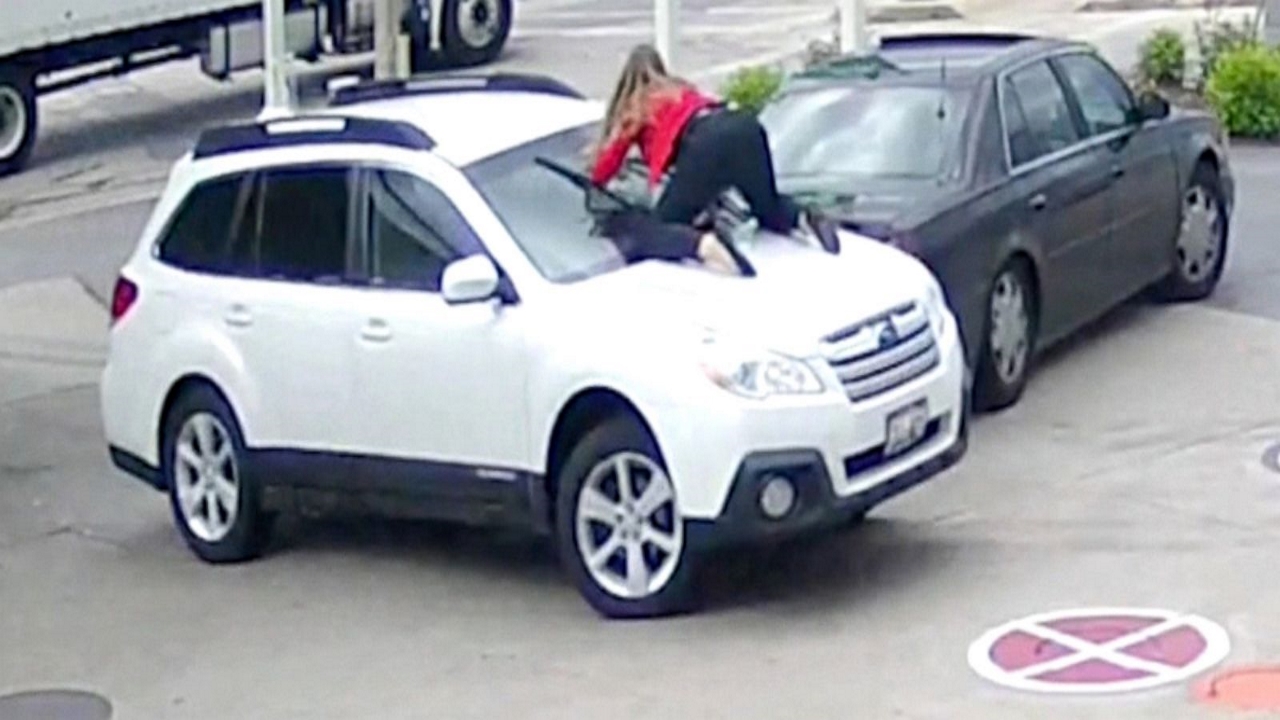 Wisconsin woman jumps on hood of her SUV to prevent theft