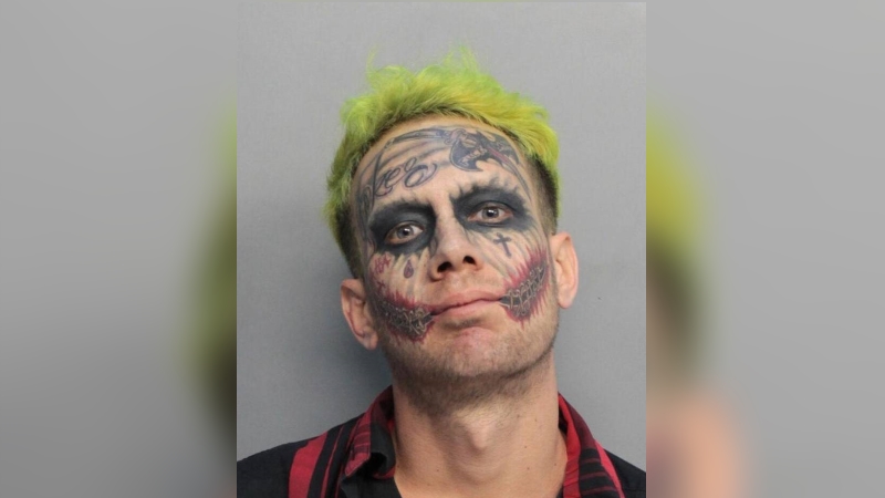 Tattooed 'Joker' accused of pointing gun at traffic