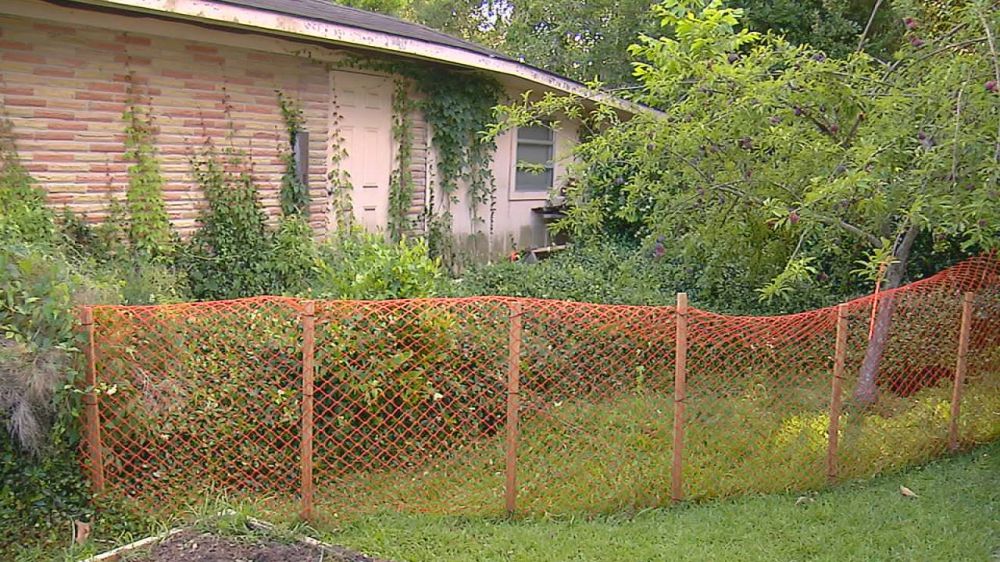 Sherwood Forest sinkhole damaging home, yard