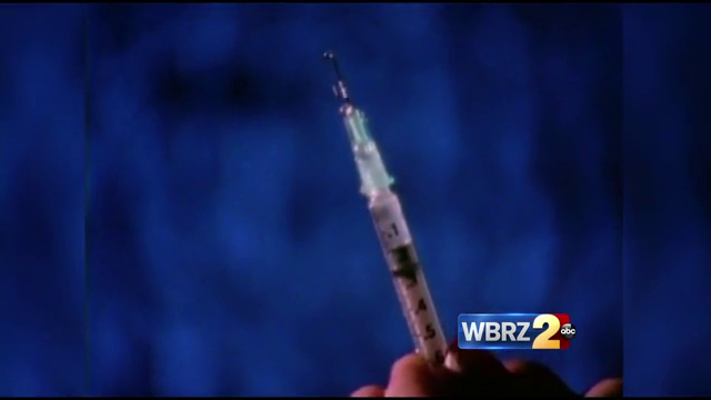 Attempted heroin hand-off in court nets arrest