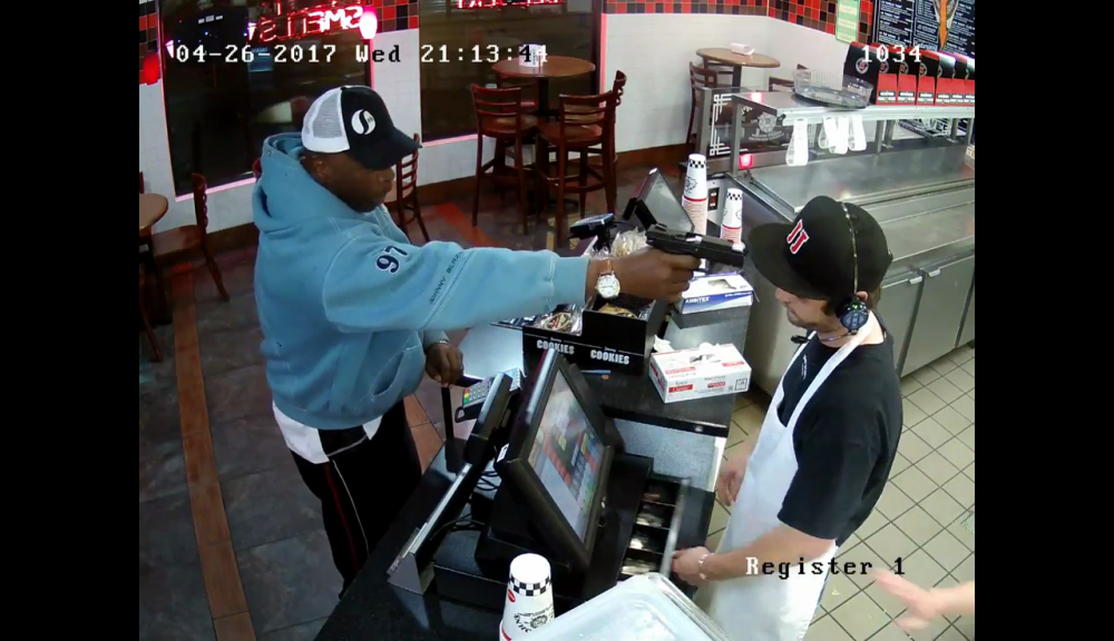 WATCH: Stoic Kansas employee hands over cash with gun in his face